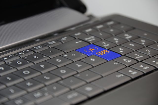 GDPR compliance button on a keyboard to display secure transcription services for qualitative research